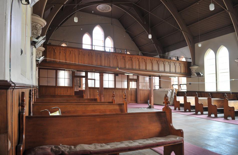A number of the wooden pews are destined to be repurposed into furniture for the new apartments,...