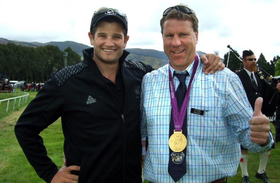 Olympic gold medallist Nathan Cohen lends his bling to West Otago A and P Society president Brian...