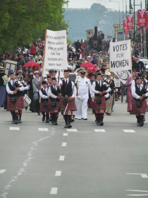 The grand parade marches down Thames St.