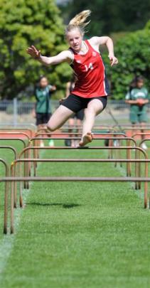 Fairfield's Jordyn Patterson (12) in the hurdles