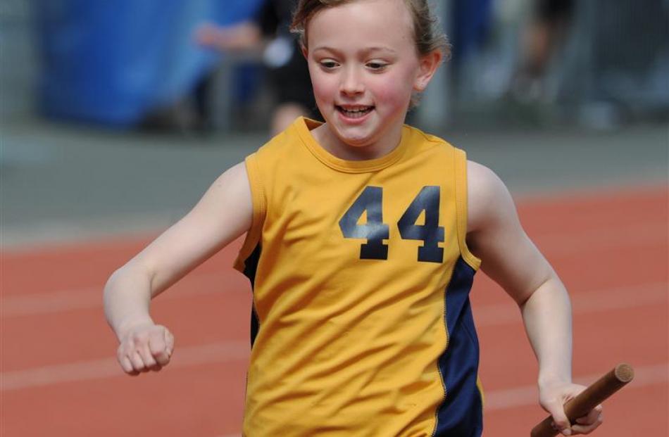 George Street's Zoe McCane (9) carries the baton during a relay