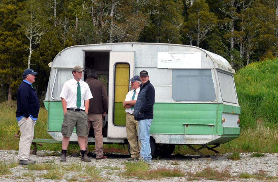 This old caravan is the venue for registrations by potential buyers.