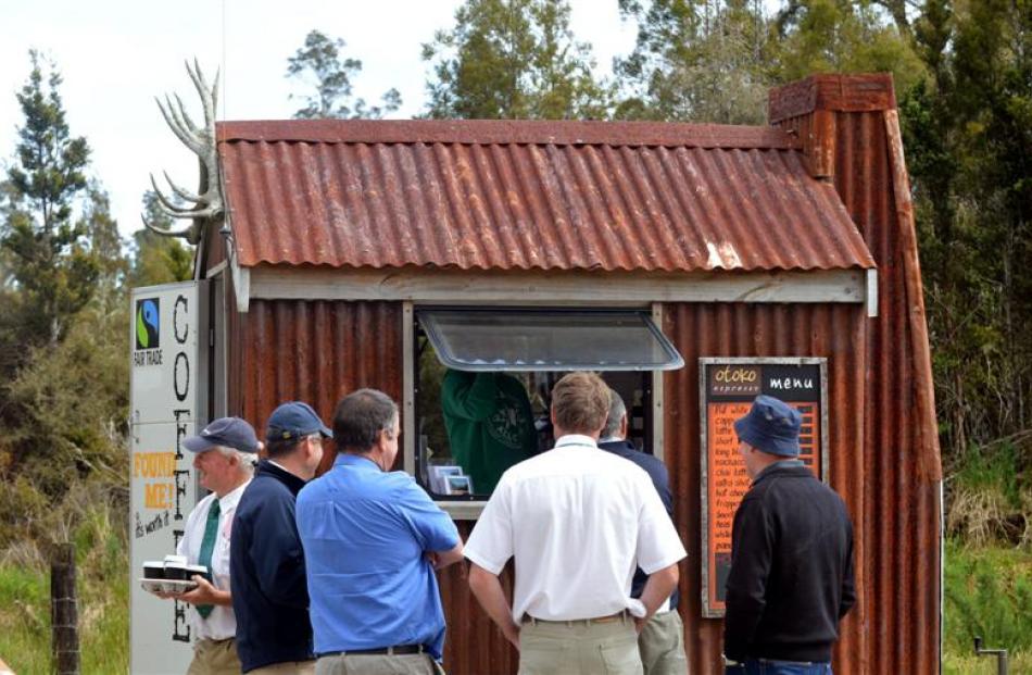 A mobile coffee unit does a brisk trade among sale-goers.