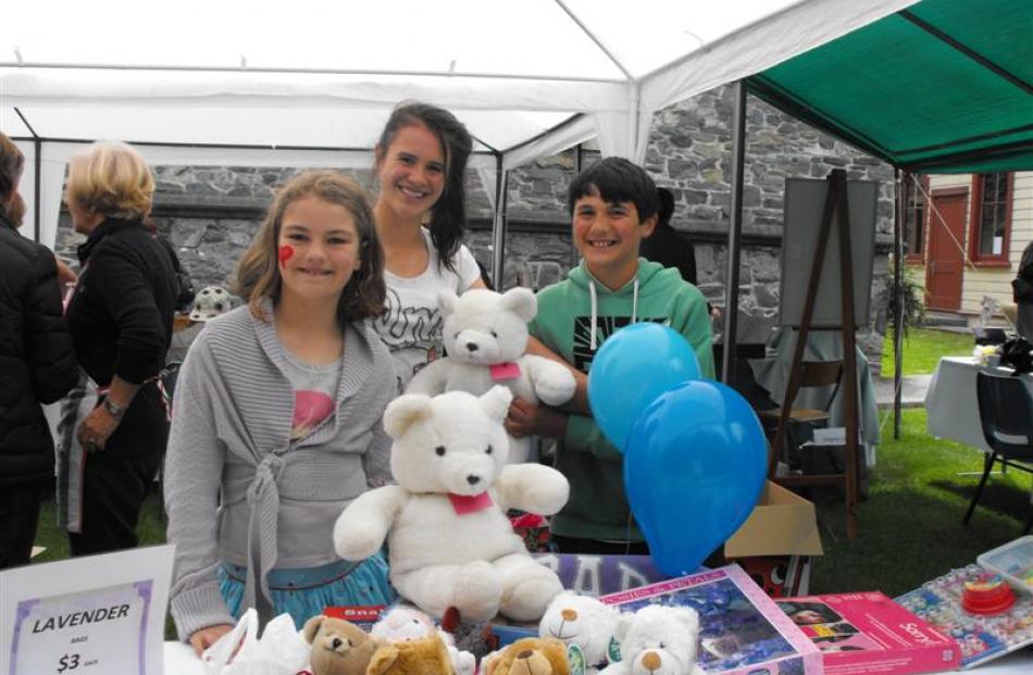 In the children's corner selling teddy bears  are  Mackenzie Shewan (10), Gracyn Liscom (12) and...