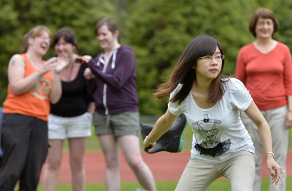 Pan Chen (24) winds up during the womens gumboot throw.