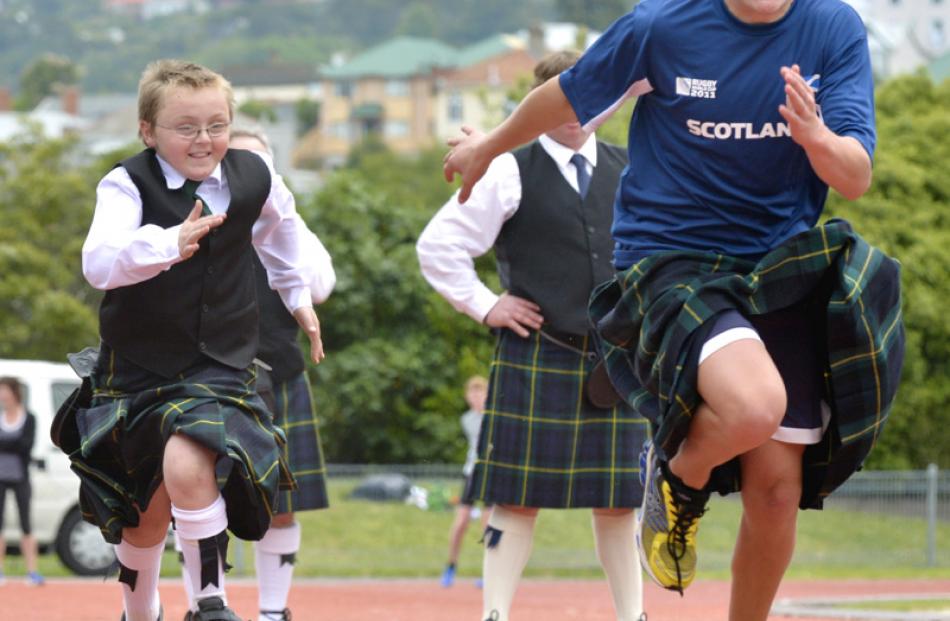 Tykler Morris-Hill (10) and Hugh James (14) race away in the Kilties Dash.