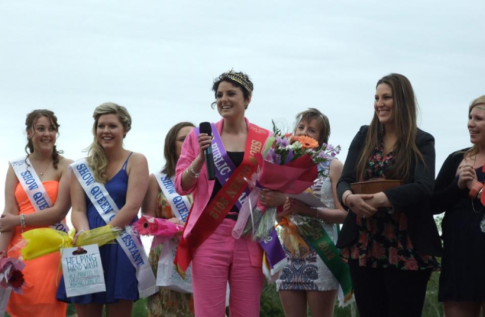 2012 Show Queen Rachel Dick (centre) gives her acceptance speech while fellow contestants (from...