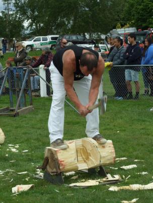 Brian Gutsell, of Gore, competes in the woodchopping section.