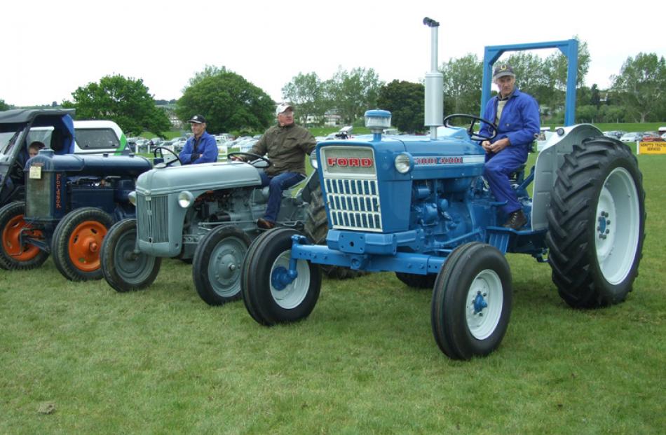 From left: John Watt, Bob Stevenson, and Neville King, with their vintage tractors.