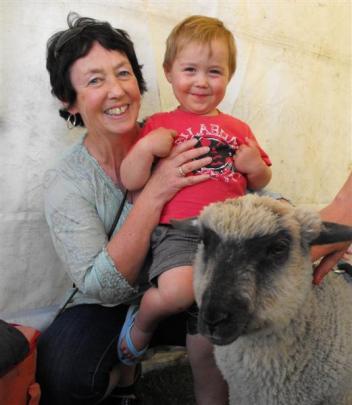 Karen Anderson with grandson Sam Stewart (2) and Sooty the lamb.