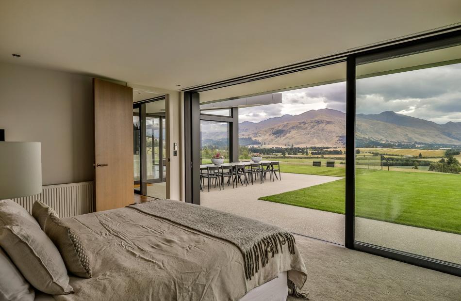 The bedrooms have views of the surrounding landscape.