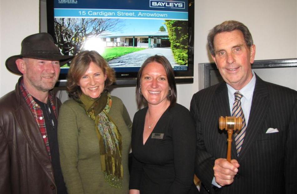 Jeff Dickie, left, and his wife Liz, of Dunedin, with Bayleys Queenstown saleswoman Katharine...