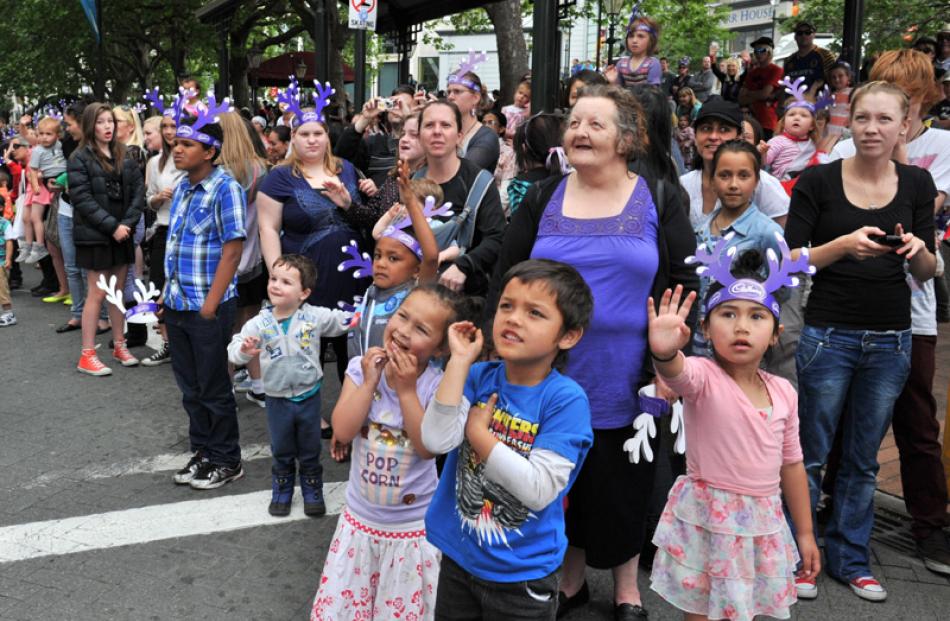 Jayda Pelesa (4), brother Kruize Pelesa (5), grandmother Helen Pelesa and Chozen Cassidy (5) wave...