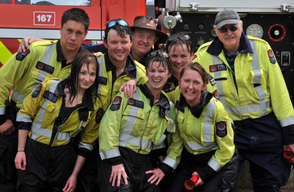 The victorious firefighters' team (from left front) Casey Figgins, QFFs Seraya Figgins and Amanda...