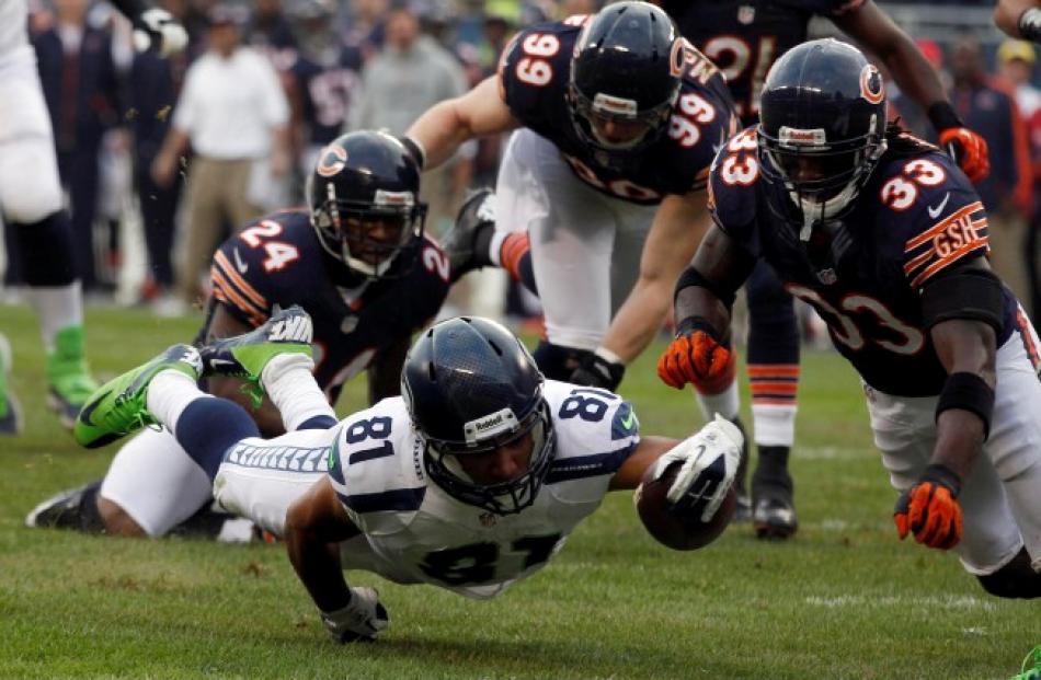 Seattle Seahawks wide receiver Golden Tate (81) dives in for a touchdown past Chicago Bears...