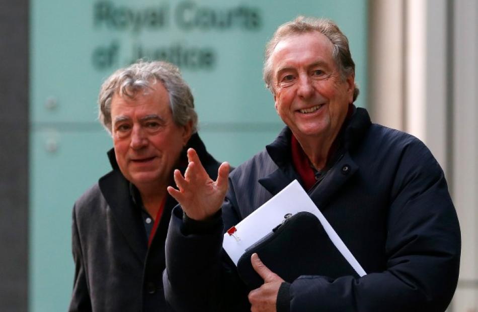 Eric Idle (R) and Terry Jones leave the High Court in London where they are being sued by one of...