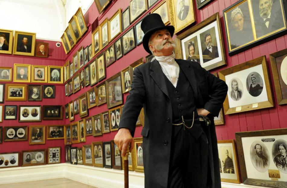 David Willson, of Oamaru, admires settlers' portraits.