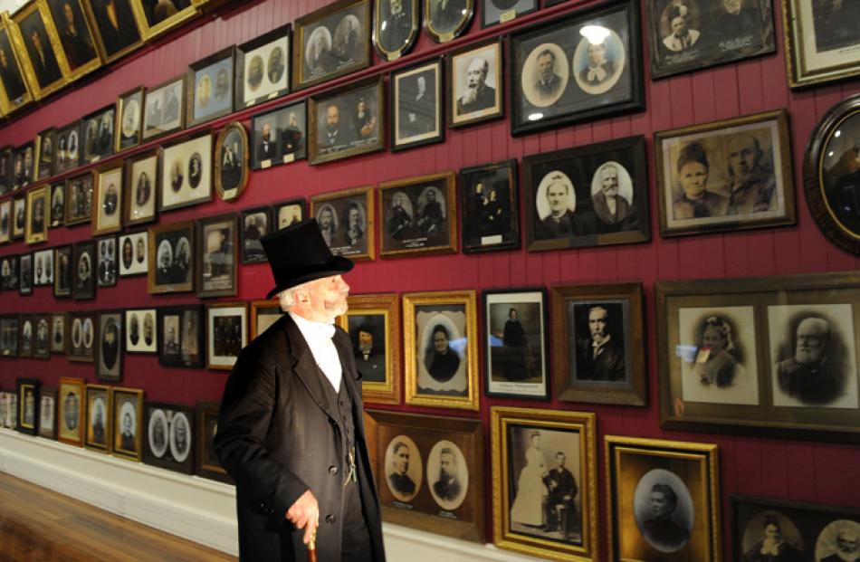 David Willson, of Oamaru, admires settlers' portraits.