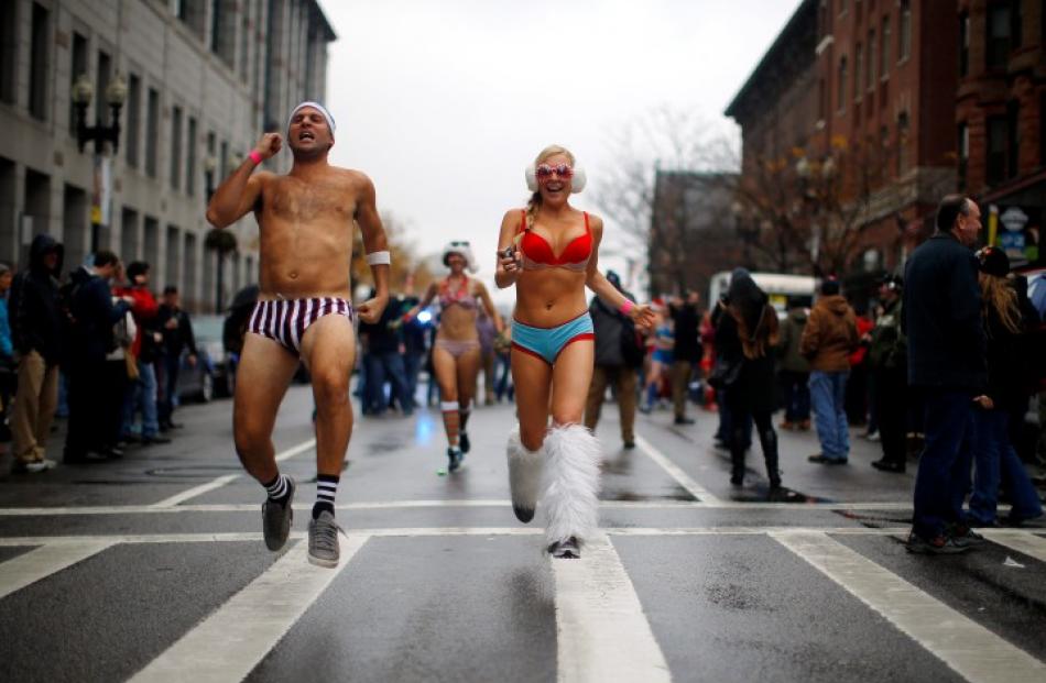 Participants in Boston's annual 'Santa Speedo Run' leave the starting line. REUTERS/Brian Snyder