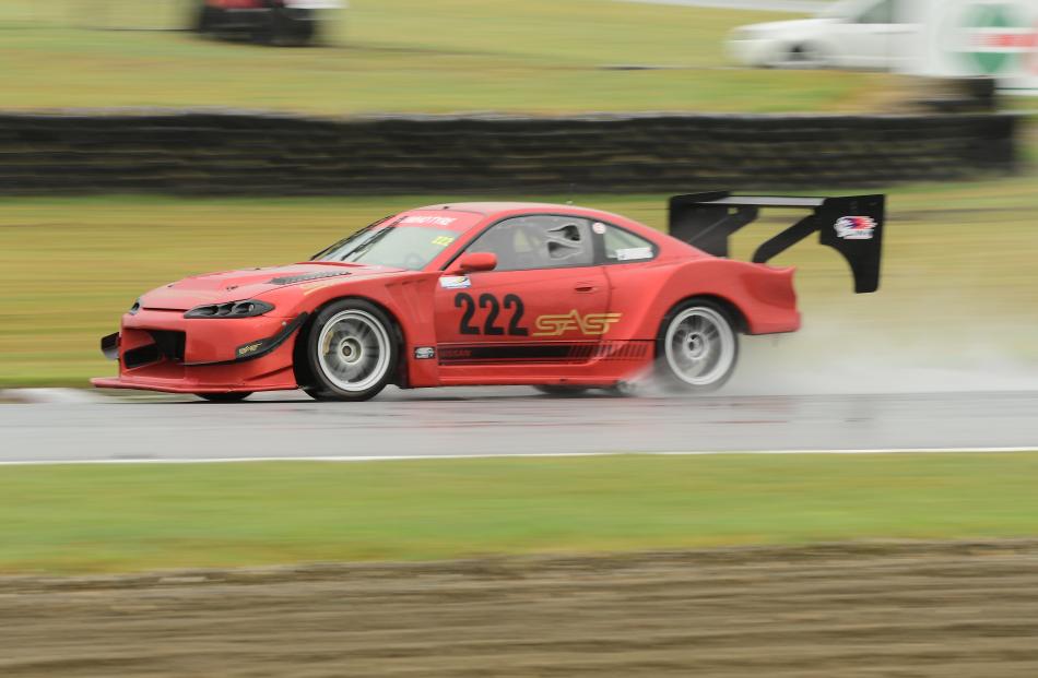 Paul Brooks (Ohoka), in his Nissan 200SX S15, sets a good pace in a wet OSCA race.