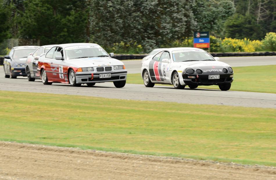Darfield driver Greg Mitchell, in his BMW Alpina 88, is about to pass Corey Ashworth, in a Toyota...