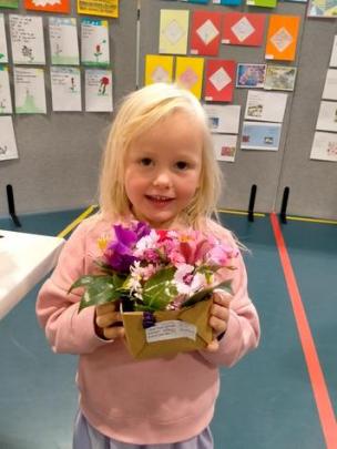 Hornby Primary School pupil Sasha with her flower arrangement. Photos: Supplied