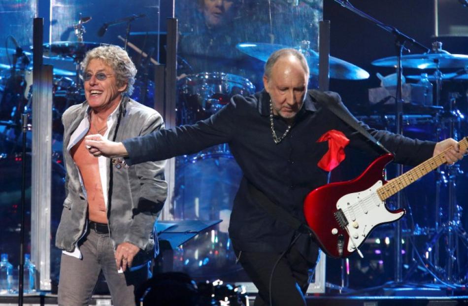 Roger Daltrey (L) and Pete Townshend of The Who perform during the '12-12-12' benefit concert for...