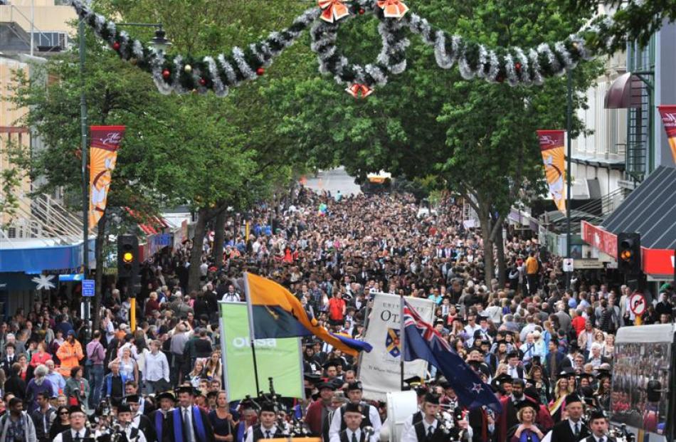 More than 500 University of Otago graduands move along George St, Dunedin, towards the Regent...