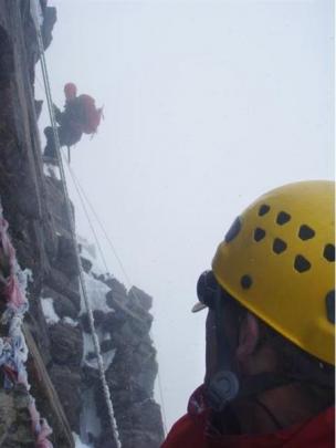 Philip Somerville abseils down the Summit Rocks, with Matthew Gilberston and tatty slings from...