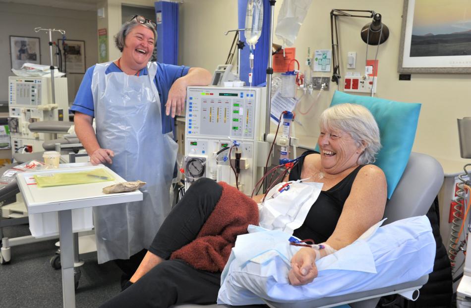 Dialysis nurse Leighanne Everett shares a joke with patient Karen Williamson.