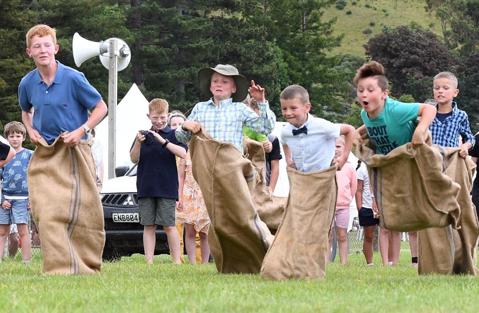 The competition was fierce in the sack race although James Cooper (9, centre) went from first to...