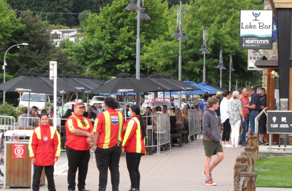 Security guards patrol Ardmore St in Wanaka. Photo: Marjorie Cook