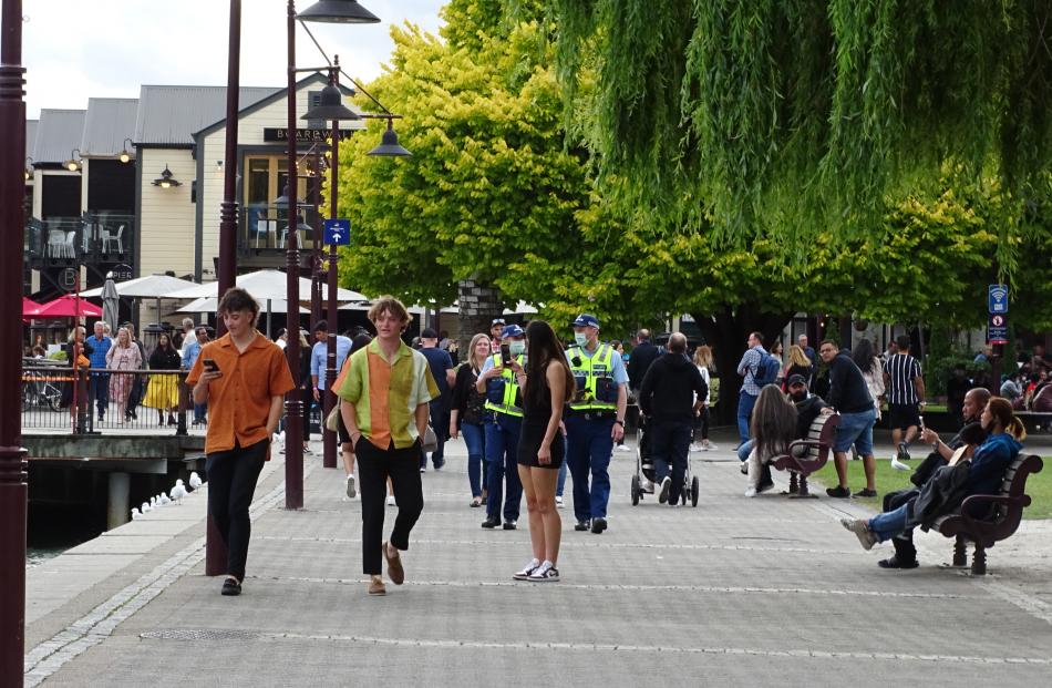 Police patrol Earnslaw Park in Queenstown as as young people flood in. Photo: Cass Marrett