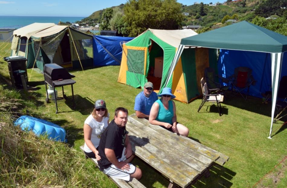 Idyllic ... Christchurch couple Charlotte and Ray Greaves (left) relax with friends Gary and...