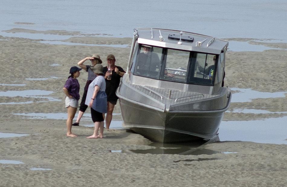 The occupants of another boat had to wait for the incoming tide after running aground on their...