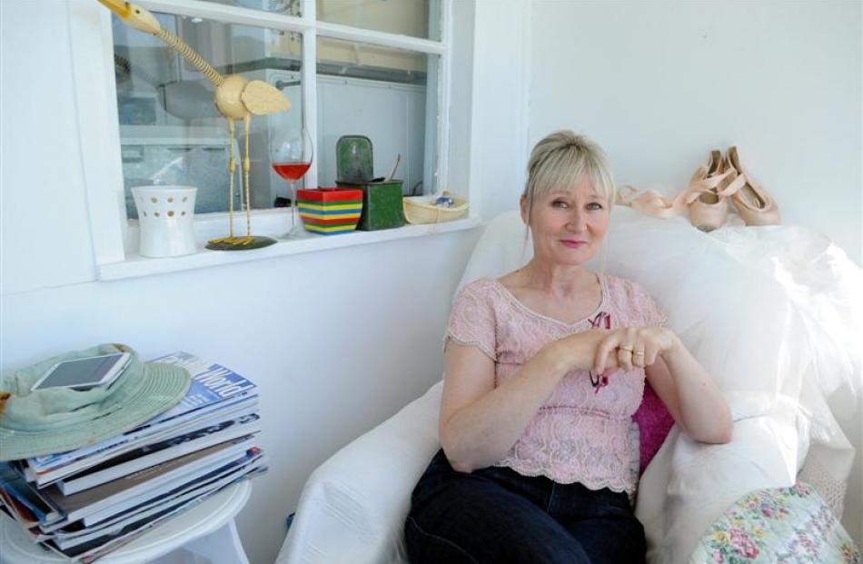 Dunedin collector Lyndall Frost relaxes among some of her treasured finds, displayed in the...