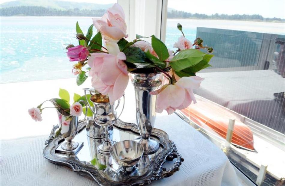 Silverware and flowers decorate a table.