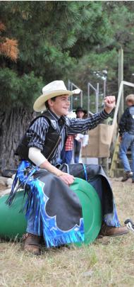 Brendon Johnston (12) of Ashburton practises riding on an empty barrel.