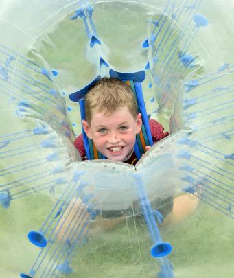 Harry McRae (9), of Christchurch, plays in a bumper ball.