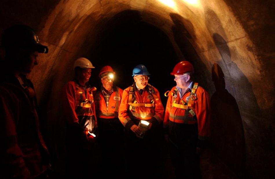 Cr Andrew Noone (second from left) and Michael Guest (right, a former councillor) explore a sewer...