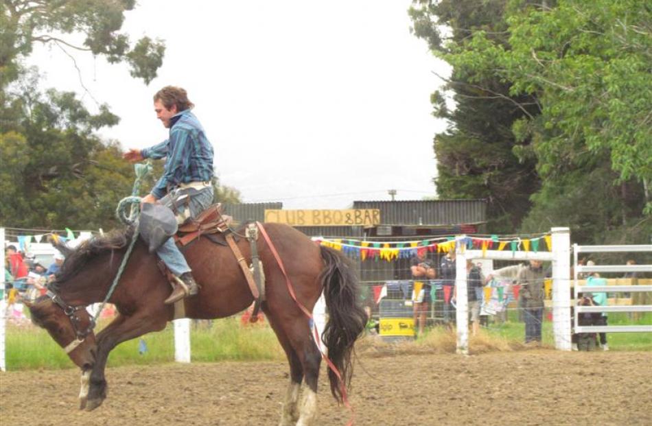 Hayden Tisdall (18), of Oamaru, holds on for a second-place finish in the second division saddle...