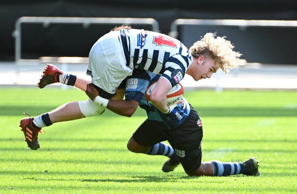 Otago Boys’ High School winger Aaron Morrison was tackled by Nelson College opposite Timoci...