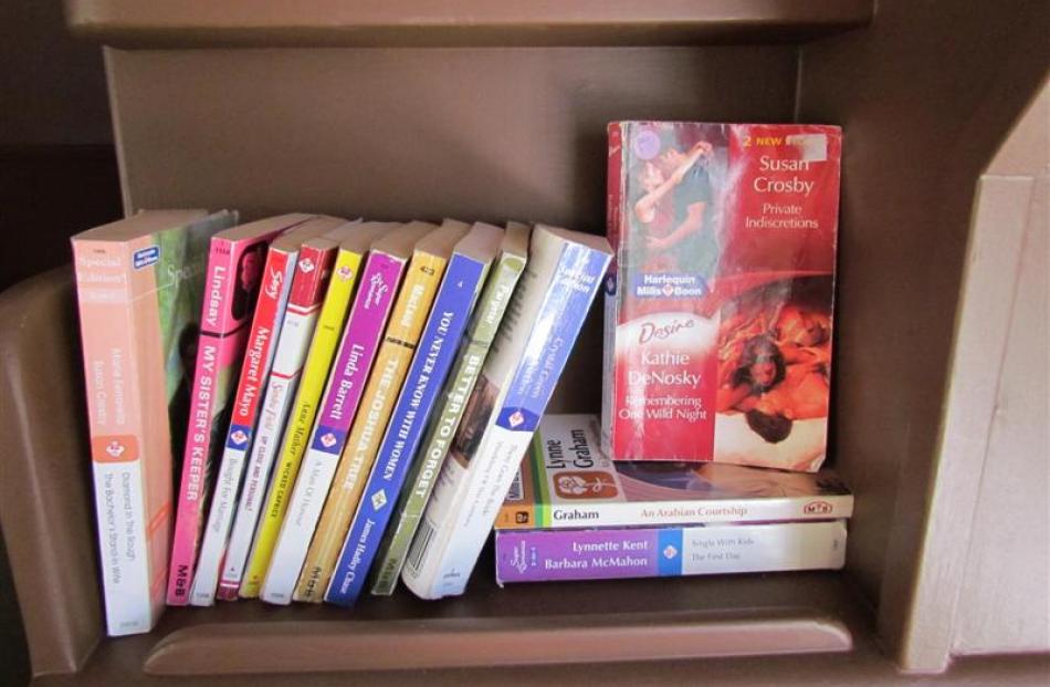 A stack of Mills and Boon books for guests' reading pleasure.