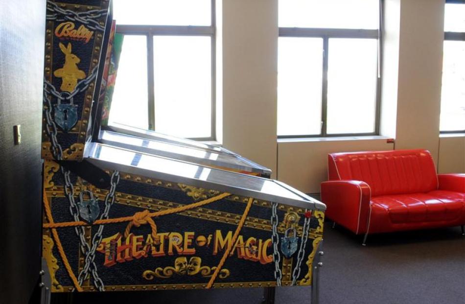 A Theatre of Magic pinball machine completes  the central Dunedin office.