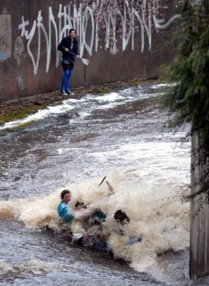 With the Water of Leith in flood following heavy rain it was a fair bet students would be pitting...