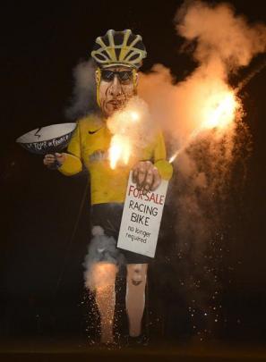 An effigy of U.S. cyclist Armstrong burns during Bonfire Night celebrations in Edenbridge, south...