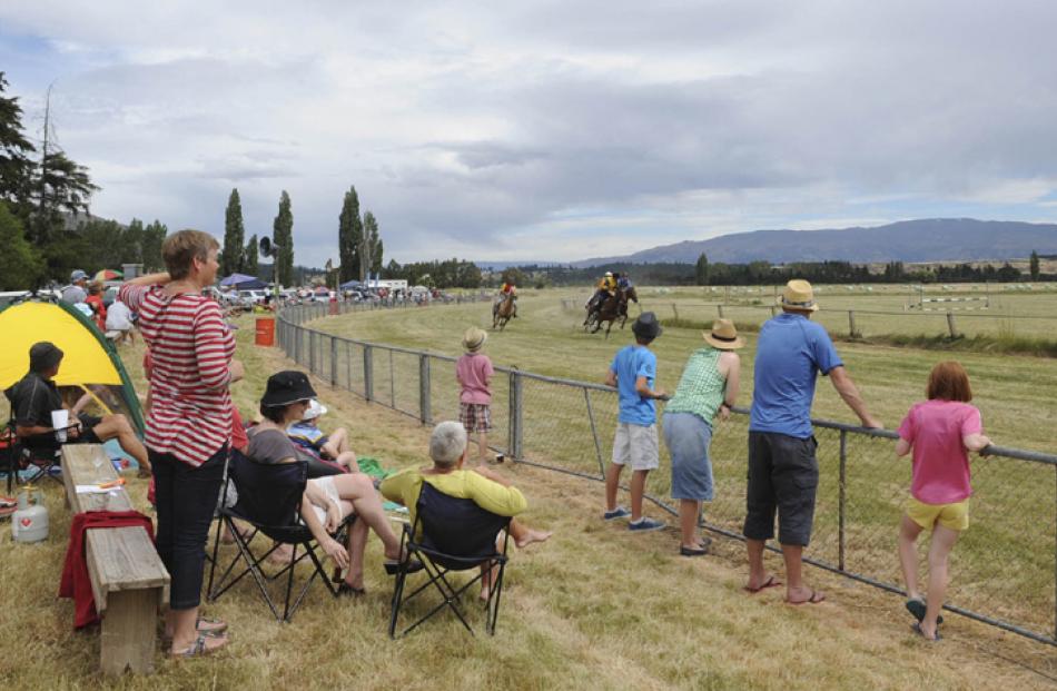 Spectators watch the 1/4 Mile Sprint at the Hawea Picnic Races. Photos by Linda Robertson.