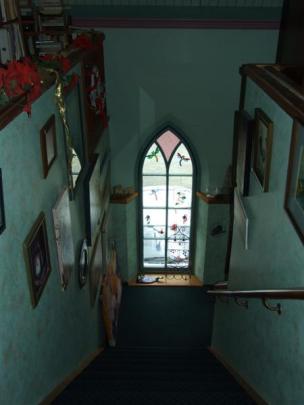 Looking down the stairs from the mezzanine floor at one of the many arched windows restored by Mr...