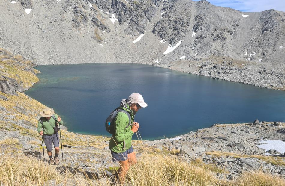Walking from Lake Alter on the Remarkables to Wye Creek in Queenstown are Paul Tankard and his...