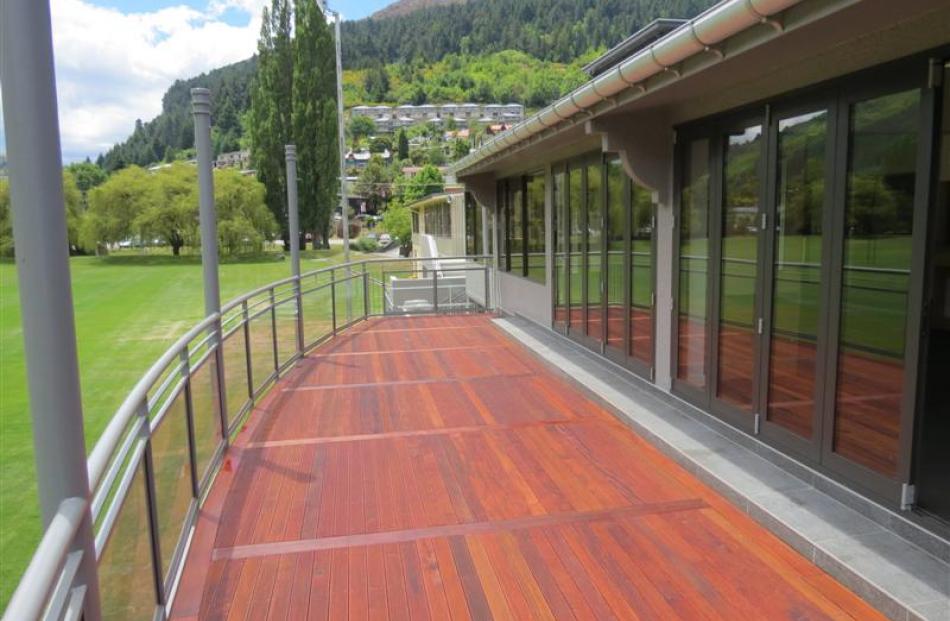 Timber decking and a metal and glass balustrade make for an attractive balcony, which is an ideal...